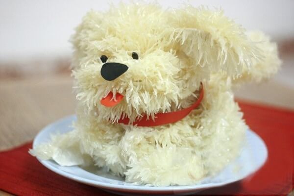 Chú cún dễ thương được tỉa bằng quả bưởi Chú cún dễ thương được tỉa bằng quả bưởi