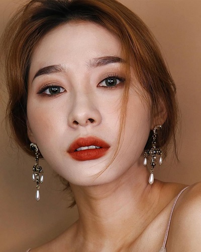 Son màu cam đất cho môi thâm