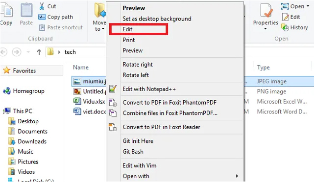 Chọn bức ảnh mà bạn muốn chèn chữ -> Click chuột phải vào ảnh. Khi đó, thanh công cụ mới hiện ra, bạn chọn Edit