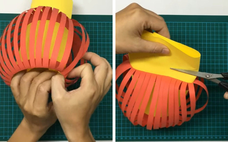 Bạn tiếp tục dùng băng dính hai mặt để cố định phần ruột và phần vỏ đèn lồng với nhau